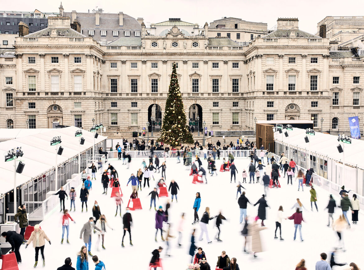 Somerset House Ice Rink People ice skating in front of a Christmas tree